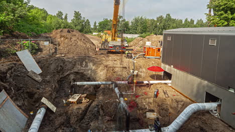 Working-on-the-foundation-and-plumbing-of-a-large-construction-site---time-lapse