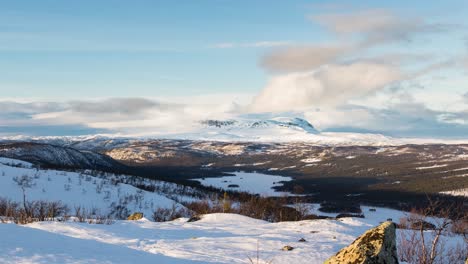 Clouds-Moving-Above-Snowy-Hallingskarvet-Mountain-Range-During-Winter-In-Norway---hyperlapse