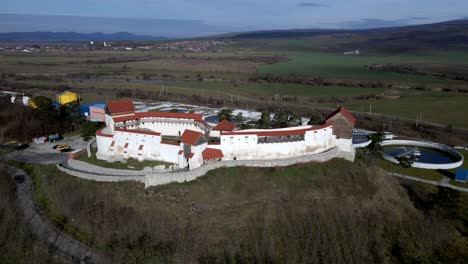 Aerial-View-Of-Restored-Feldioara-Fortress---Marienburg-Near-The-Sewage-Treatment-Plant-In-Brasov,-Romania