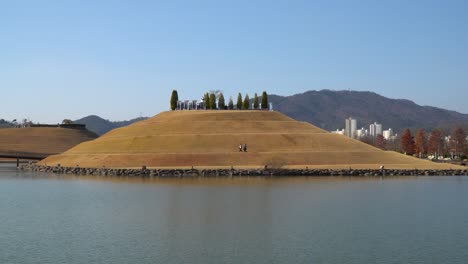 Lake-Garden-of-Suncheonman-Bay-National-Garden-with-people-walking-on-Bonghwa-Hill---distant-static-landscape