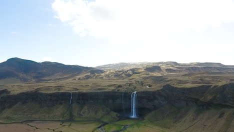 Drone-Shot-Rising-Up-Above-Iceland-Mountain-Waterfall