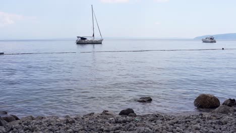 Lonely-sailboat-at-anchor-in-Kvarner-Bay,-Croatia