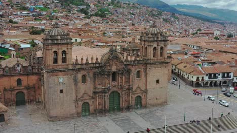 Cusco,-Peru-Frontis-of-Main-cathedral-and-city-Drone-UHD