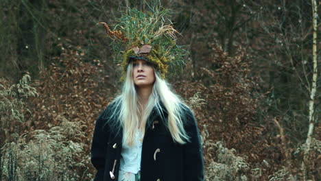 Beautiful-Wiccan-woman-in-nature-crown-walks-in-winter-flurry