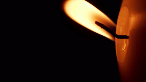 Vertical-rotation-of-Closeup-of-candle-flame-on-black