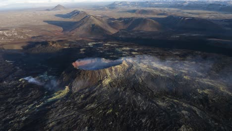 Aerial-view-of-boiling-Geldingadalir-Volcano-during-sunny-day-in-Iceland---Spectacular-volcanic-landscape-during-daytime