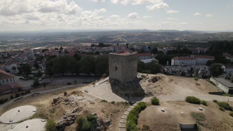 Slow-drone-pan-around-historic-Guarda-castle-elevated-on-hill