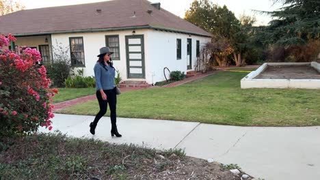 Hispanic-Female-walking-on-historic-grounds-at-Rancho-Camulos-Museum