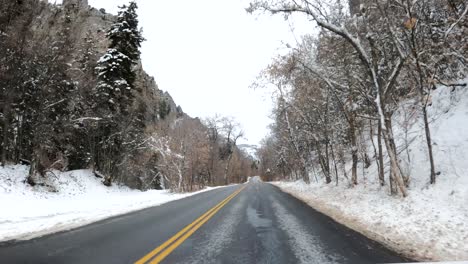 Driving-POV-of-Snowy-Mountain-Roads-in-American-Fork-Canyon,-Utah