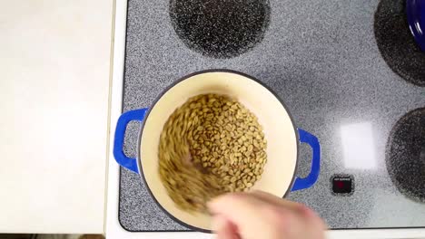 Roasting-green-coffee-beans-at-home-in-a-cast-iron-pot
