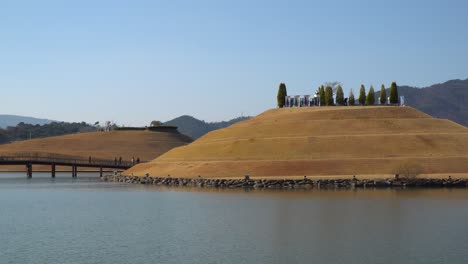 Suncheonman-Bay-National-Garden---Travelers-walking-on-Bridge-of-Dreams-towards-Bonghwa-Hill-in-Autumn-in-Lake-Garden
