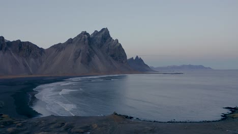 Panorama-shot-of-Vestrahorn-mountain-on-volcanic-Stokksnes-beach-during-early-morning-on-Iceland-Island
