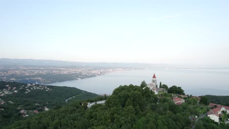 Church-on-hill-with-beautiful-Kvarner-Bay-in-background,-Croatia