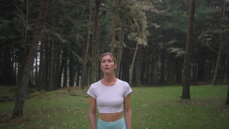 Lost-attractive-woman-wearing-sportswear-looking-scared-in-mystical-moody-forest