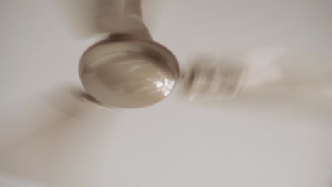 Close-up-of-a-ceiling-fan-rotating-on-high-speed-on-a-summer-day-in-India