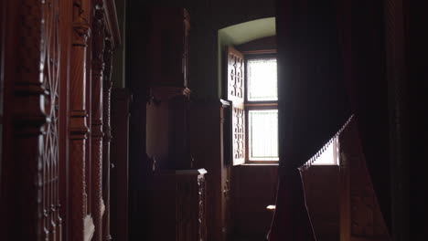 Revealing-a-Dark-wooden-Interior-room-in-Medieval-Castle-Bojnice,-Slovakia,-Europe-4K