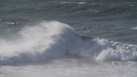 Slow-motion-of-a-big-wave-hitting-another-big-wave-in-Nazaré,-Portugal