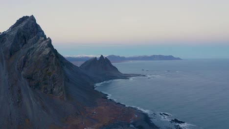 Aerial-view-of-Vestrahorn-Mountain-in-Stokksnes,coastline-and-Brunnhorn-with-Eystrahorn-in-the-background,Iceland