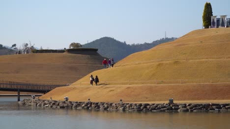 Travelers-on-Spiral-Trails-in-Lake-Garden-of-Suncheonman-Bay-National-Garden-walking-around-Bonghwa-Hill-with-clear-sky-background