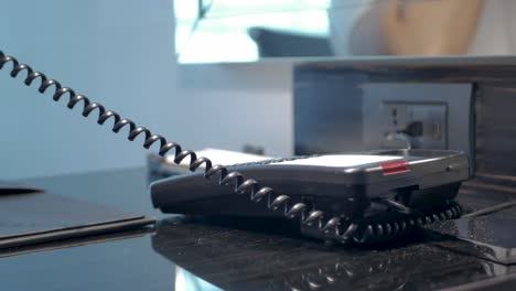 POV-to-telephone-while-using-hand-answer-telephone-when-working-from-home