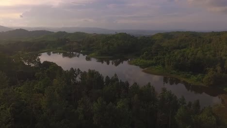Aerial-view-of-a-sunset-and-a-lake-in-Venezuela-with-dramatic-orange-sky