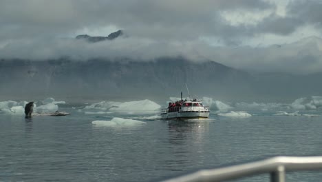Boat-drives-twords-camera-through-icebergs-in-Iceland