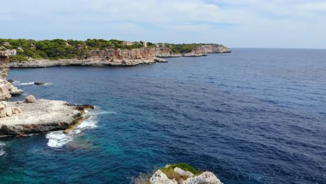 Aerial-shot-approaching-the-rugged-coast-of-Mallorca,-Spain