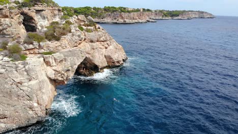 Aerial-view-of-spectacular-Spanish-shoreline,-featuring-rocky-caves,-stacks-and-arches