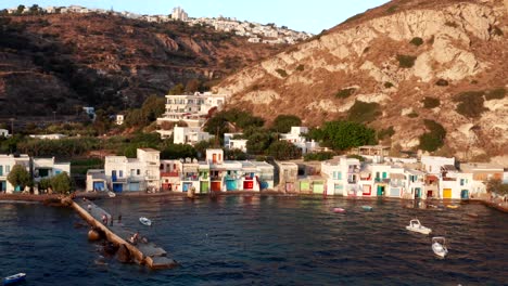 Aerial-of-colorful-house-architecture-in-Klima-village-seaside-in-Milos-beach