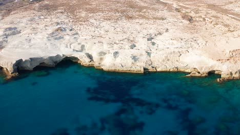 Sarakiniko-Beach,-Sand-Rock-Formation-Coastline-and-Caves,-Milos-Island,-Greece