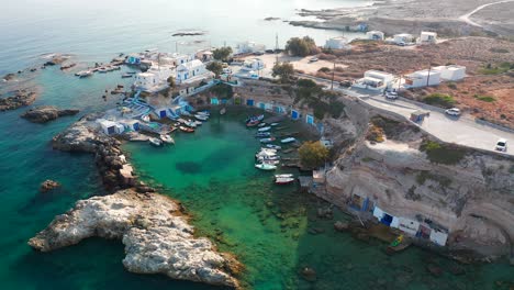 Mandrakia-small-fishing-village-port-with-boats-and-yachts,-Milos-island-aerial-view