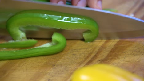 slicing-bell-peppers-in-julienne-on-wooden-board-kitchen-healthy-healthy-diet-green