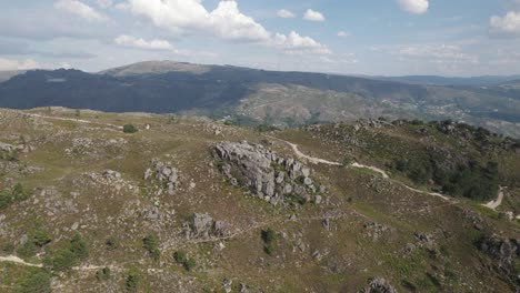 Aerial-half-orbit-wide-Mountain-range-landscape,-Rocky-hilltop,-Gerês-National-Park