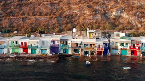 Pull-back-of-colorful-house-architecture-in-Klima-village-seaside-in-Milos-beach