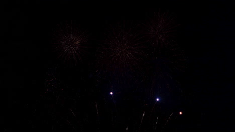 Tons-of-tiny-fireworks-explode-in-the-dark-sky