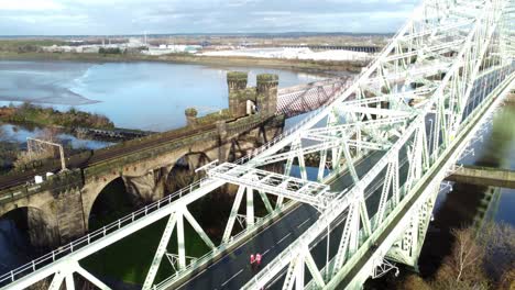 Charity-Santa-dash-fun-run-over-Runcorn-Silver-Jubilee-bridge-Aerial-view-dolly-right-tilt-up