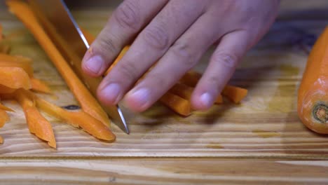 cutting-carrot-into-julienne-on-wooden-board-kitchen-healthy-healthy-diet