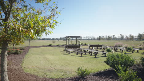 Wedding-ceremony-set-up-in-lush-green-field-without-people