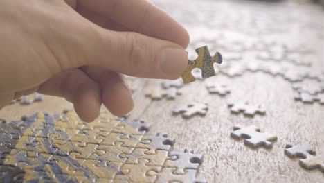 A-guy-holding-jigsaw-puzzle-piece