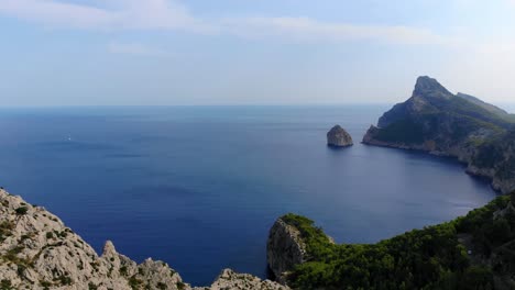 Aerial-Panoramic-View-Of-Cap-De-Formentor-With-Vast-Calm-Blue-Ocean-In-The-Background