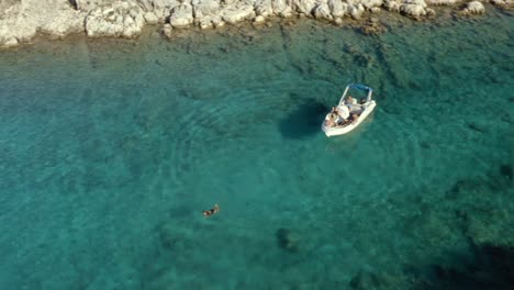 Female-Swimming-in-Tropical-Lagoon-in-Mediterranean-Sea-in-Greece,-Aerial