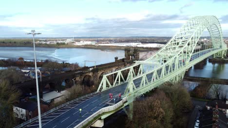 Charity-Santa-dash-fun-run-over-Runcorn-Silver-Jubilee-bridge-Aerial-view-orbit-left