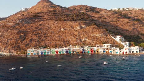Klima-beach-with-colourful-seaside-village-in-Milos-island-lateral-side-pan-shot