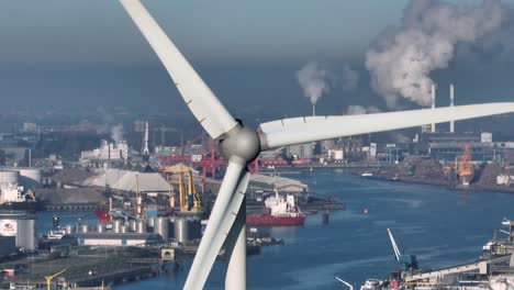 Juxtaposition-of-wind-turbines--and-factories-emitting-pollutants
