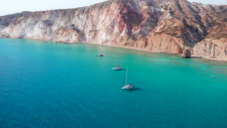 Fyriplaka-Beach-Aerial-Close-Up-Yachts-Drone-Shot-of-Greek-Milos-Island