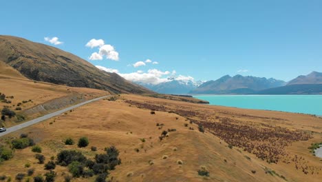 Aerial-view-of-Lake-Pukaki-and-a-road-pointing-to-Mount-Cook