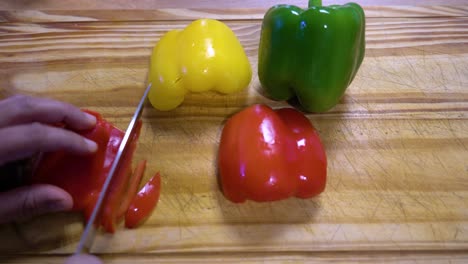 slicing-bell-peppers-in-julienne-on-wooden-board-kitchen-healthy-healthy-diet