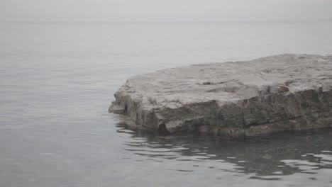 Beautiful-plain-rocks-surrounding-by-the-sea-in-Canda---Close-Up-Shots
