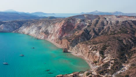 Fyriplaka-beach-aerial-panoramic-view,-pull-in-drone-shot-of-Greek-Milos-island