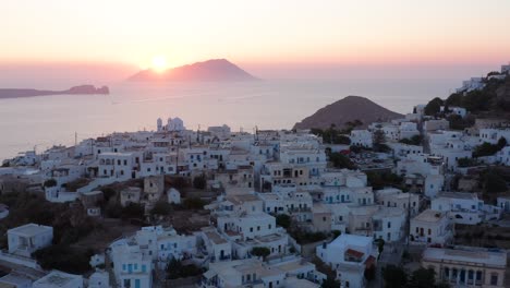 Plaka-milos-town-overlloking-the-gulf-during-dazzling-sunset-landscape,-Greek-island